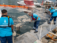 Municipality workers operate to clean the mucilage on the surface of the Caddebostan shore of the Marmara Sea in Istanbul, Turkey, on June 8...