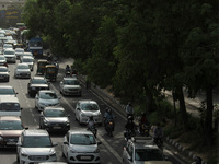 Heavy vehicular traffic is seen on a road, after authorities announced various relaxations as a part of unlocking the national capital that...