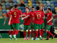 Joao Cancelo of Portugal celebrates with teammates after scoring during the international friendly football match between Portugal and Israe...