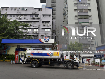 HP fuel pump with a high-rise building can be seen in Kolkata, India, 10 June, 2021. Petrol price in Kolkata is Rs 95.52 per litre and Diese...