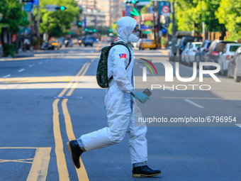 Chemical troops disinfect public areas in New Taipei City, as the number of Covid-19 domestic cases and deaths has risen, amid community tra...