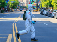 Chemical troops disinfect public areas in New Taipei City, as the number of Covid-19 domestic cases and deaths has risen, amid community tra...