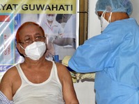 A medic administers a dose of COVID-19 vaccine to a senior citizen   at a vaccination centre in Guwahati, India on June 12,2021. (