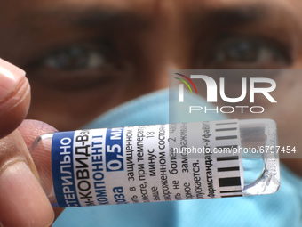 A nurse shows off a vial of the Russian Covid-19 Vaccine  Sputnik V at a hospital on June 12,2021 in Kolkata,India. (