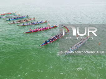 Dragon boats group up after their race in Sai Kung, on June 14, 2021. The races resumed in some locations after being suspended last year in...