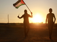 Palestinian protesters on the border with Israel in the southern Gaza Strip region of Rafah during a protest on June 15, 2021 against the Is...