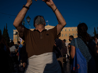  A pensioner taking a selfie during a demonstration in Athens, Greece, on June 16, 2021. Thousands of Athenians gathered outside the parliam...