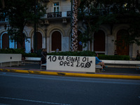  A graffitti against the 10 hour work day scheme that is introduced by the Greek government's new legislation.  (