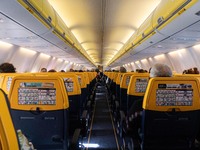 Flying during the Covid-19 Coronavirus pandemic inside a Boeing 737-800 aircraft of Ryanair low cost carrier with destination Chania in Cret...
