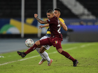 Casseres  player from Venezuela disputes a bid with Plata player from Equador during a match at the Engenhão stadium for the Copa América 20...
