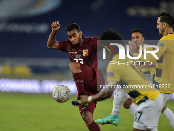Casseres  player from Venezuela disputes a bid with Mena player from Equador during a match at the Engenhão stadium for the Copa América 202...