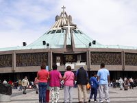 Faithful attend at the Basilica of Santa Maria de Guadalupe to receive the blessing by the priest.  The Basilica of Gudalaupe is the second...