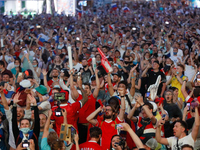Russian supporters celebrate while watching a live stream during the UEFA Euro 2020 Championship match between Denmark and Russia on June 21...