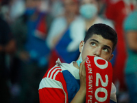 Russian supporter watches a live stream during the UEFA Euro 2020 Championship match between Denmark and Russia on June 21, 2021 at Fan Zone...