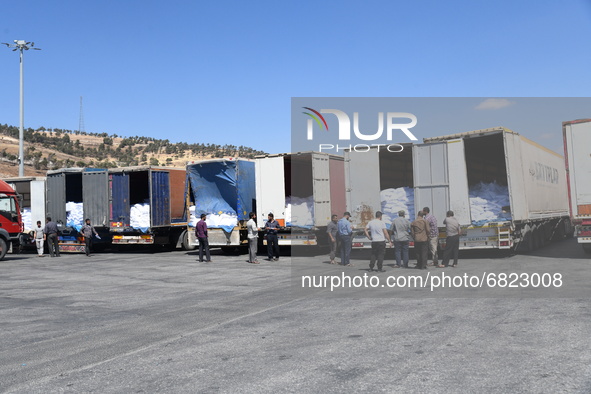 Trucks Loaded With Humanitarian Aid Provided By The United Nations World Food Program Enter Northern Syria Through Bab Al-Hawa Crossing on J...