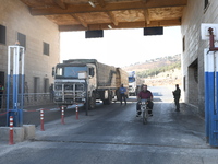 Trucks Loaded With Humanitarian Aid Provided By The United Nations World Food Program Enter Northern Syria Through Bab Al-Hawa Crossing on J...