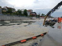 The photo shows the cleaning of mucilage covering the surface of the Sea of Marmara on the Turkish coast of Istanbul on June 23, 2021. In li...