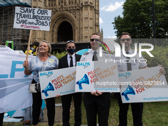 LONDON, UNITED KINGDOM - JUNE 23, 2021: Pilots join hundreds of protesters representing the travel industries protesting outside Houses of P...