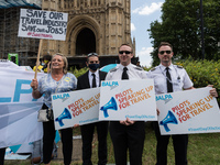 LONDON, UNITED KINGDOM - JUNE 23, 2021: Pilots join hundreds of protesters representing the travel industries protesting outside Houses of P...