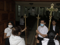 Liturgical members at the entrance of the San Juan Bautista chapel in Culhuacán, Mexico City, Mexico, on June 24, 2021 prior to a solemn mas...