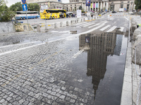Reflection of Culture and Science Palace in puddle. Building built as a gift of Stalin to the Polish people after the world war II. 10 July,...