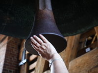 Tourist are touching the clipper of the Sigismund Bell (Zygmunt) during an open day marking the 500th anniversary of the hanging of the bell...