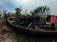 A  boat hit's the house and destroyed house caused by the cyclone. She lost every necessary material after Cyclone YAAS from regular tides w...