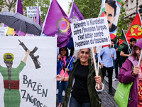 A Kurdish activist holds an anti-fascist sign during the Defend Kurdistan demonstration in Paris, France, on July 4, 2021. On the weekend of...