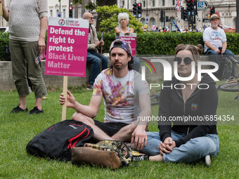 LONDON, UNITED KINGDOM - JULY 05, 2021: Demonstrators gather in Parliament Square for 'Kill the Bill' protest to oppose government’s Police,...