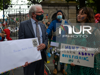 Malcolm Noonan (L), an Irish Green Party politician and Minister of State for Heritage and Electoral Reform meets with Extinction Rebellion...