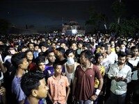 A crowd outside a factory named Hashem Foods Ltd. in Rupganj of Narayanganj district, outskirts of Dhaka, Bangladesh on July 08, 2021.  (