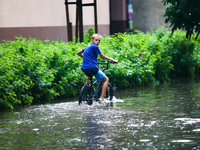 Streets of Podgorze district are flooded with water after heavy rain shower in Krakow, Poland on July 9, 2021.  (