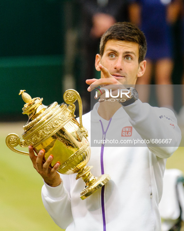 Novak Djokovic seen with the championship trophy on the centre court on Gentlemen's Singles Final day 13 of the Wimbledon Lawn Tennis Champi...