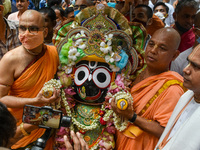 Idol of Jaganath is been transported to his chariot , during Rathyatra festival in Kolkata, India, on 12 July 2021. Chariot festival or Rath...
