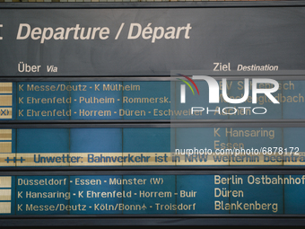 the train's cancellation is seen on the information screen at cologne central station,  Germany on July 15, 2021 as several trains delay or...