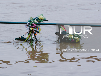 a bicycle is seen under the water from Rhine river in Cologne, Germany on July 15, 2021 as NRW experienced flooding after large amount of ra...