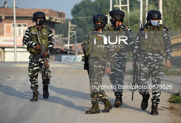 Indian soldier walk near the check point during an encounter at Alamdar Colony Danmar, Syedpora area of Srinagar,Kashmir on July 16, 2021.Tw...