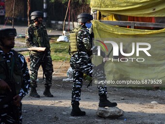 Indian paramilitary soldiers stand near the site of encounter at Alamdar Colony Danmar, Syedpora area of Srinagar,Kashmir on July 16, 2021.T...