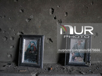 Broken portraits inside the damaged residential house where two Militants were killed in a military operation in Srinagar, Indian Administer...
