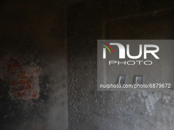 Broken portraits inside the damaged residential house where two Militants were killed in a military operation in Srinagar, Indian Administer...