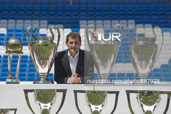 Iker Casillas poses  trophies he has won during his career in Real Madrid   at the Santiago Bernabeu stadium to announce that he will be lea...