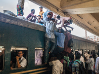 People are traveling on the train's roof top to celebrate the Eid and share happiness with their kith and keens. Dhaka July 13, 2015 (