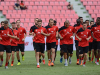 Liverpool players warm up during a training session at Rajamangala stadium in Bangkok, Thailand on July 13, 2015. Liverpool will play an int...