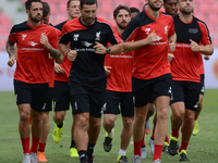 Liverpool players warm up during a training session at Rajamangala stadium in Bangkok, Thailand on July 13, 2015. Liverpool will play an int...