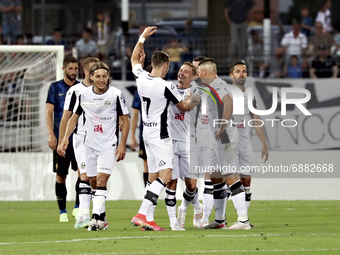 Michael Facchinetti of Lugano celebrates with team-mates after scoring the his goal during the Pre-Season Friendly match between Lugano and...
