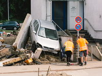 a destroyed car is seen in Bad Muenstereifel, Germany on July 17, 2021 as heavy rainfalls causes serious damages in several parts of town an...