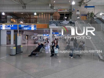 People in the departure hall with the check in desks of Athens airport. Passengers with face masks as seen at Athens International Airport A...