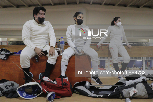 Fencers watch fellow mexican fencer and athlete Mariana Arceo train during her final training sessions at the Benito Juarez Gymnasium in Mex...