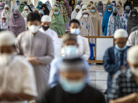 People pray during the Eid al-Adha prayer at the Al Madina Mosque, in Parung, Indonesia, on July 20, 2021 amid the Covid-19 pandemic.  (