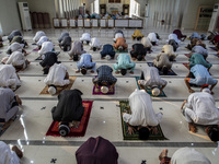 People pray during the Eid al-Adha prayer at the Al Madina Mosque, in Parung, Indonesia, on July 20, 2021 amid the Covid-19 pandemic.  (